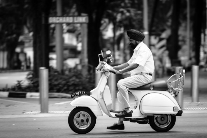 Vespa rider on Orchard Road in Singapore